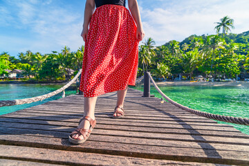 Woman's footsteps on the wooden pier