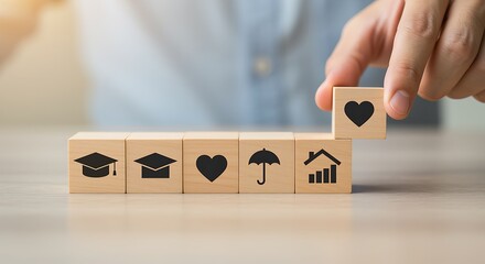 Wooden blocks with life icons graduation cap heart