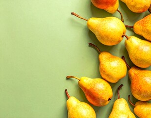 Pears arranged on a pale green background