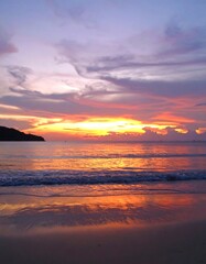 Fototapeta premium Sunset over a tranquil beach