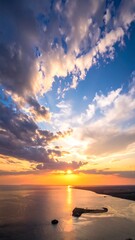 Panoramic sunset over water with dramatic clouds