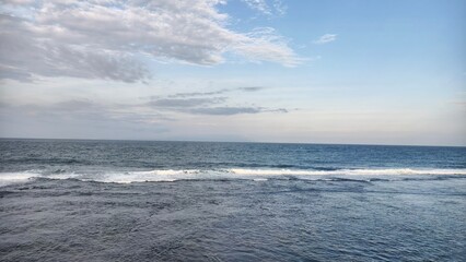 Calm Ocean Under a Cloudy Sky