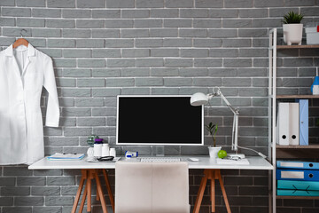 Doctor's workplace with computer in modern medical office
