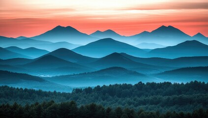 Misty mountain range at sunrise
