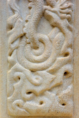 Vintage ornament on the stone. Close-up seamless texture. Stone texture. Embossed pattern.