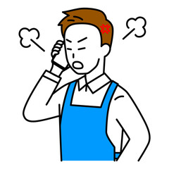 スマートフォンでの通話で怒るエプロン姿の男性