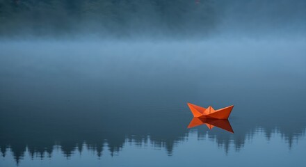 Serene Paper Boat on a Calm Lake: An orange paper boat floats peacefully on a tranquil lake, mirroring the ethereal reflections of the surrounding trees and misty ambiance.
