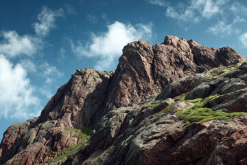 Fototapeta premium Rocky mountain landscape with textured granite under dramatic natural light