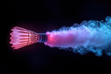 Illuminated shuttlecock with vibrant pink and blue smoke trail on black background, conveying motion and energy