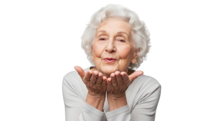Elderly woman blowing a kiss with her hands cupped, isolated on transparent background