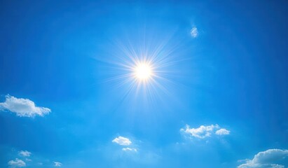 Bright shining sun in a clear blue sky with a few scattered white clouds evoking warmth and clarity