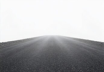 Empty asphalt road stretching forward into a dense white fog, creating a sense of mystery and uncertainty