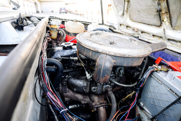 close-up of the engine compartment of a small vintage retro car
