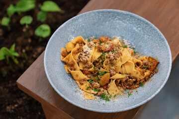 Tagliatelle pasta with meat sauce and parmesan cheese