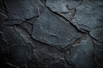 close-up view of dark slate stone texture showing natural rough, layered surfaces and subtle variations in gray tones