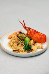 Lobster with stir-fried noodles and vegetables