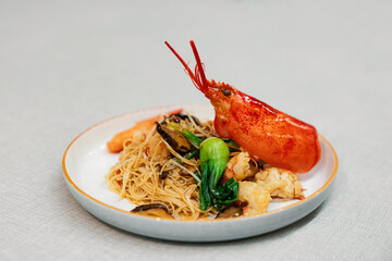 Lobster with stir-fried noodles and vegetables