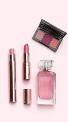 A collection of makeup essentials including lipsticks, a compact palette, and a perfume bottle displayed on a soft pink background.