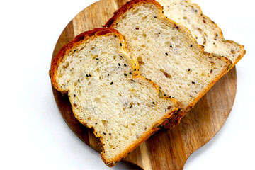 Sliced multigrain bread topped with pumpkin seeds, sunflower seeds, sesame, and black sesame.
