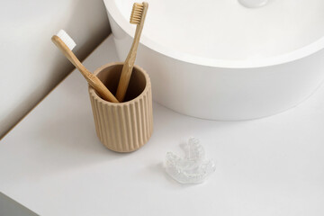 Occlusal splint near sink in bathroom, closeup