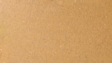 Background of brown kraft paper or cardboard texture. Abstract pattern of beige rough carton, old paper sheet.