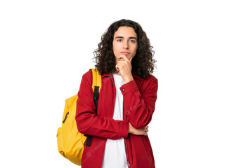portrait of a young female student with yellow backpack and thinking about something