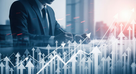 Businessman analyzing financial growth charts and upward trends.