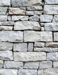 Obraz premium Close-up view of a light gray stone wall
