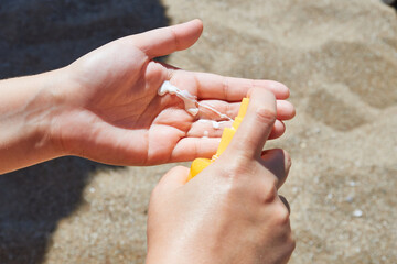 Female hands with sun protection cream Skin care concept.
