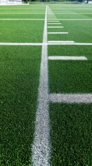 Obraz premium Professional high-quality synthetic turf football field with crisp yard lines and sharp details for sports marketing and athletic branding campaigns