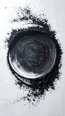 Abstract dark circle surrounded by powder