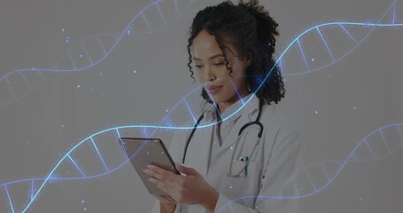 Physician tapping tablet reviewing genomic data, with animated DNA helix drifting around her - Powered by Adobe