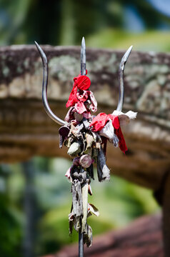 Trident with coins as offering at Embekka Dewalaya, Kandy Sri lanka