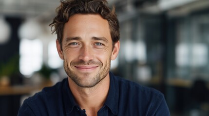 Obraz premium Smiling businessman portrait in modern office professional environment