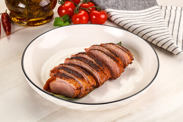 Sliced duck breast baked with cherry