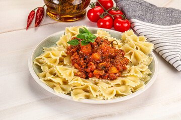 Italian pasta Farfalle Bolognese with meat