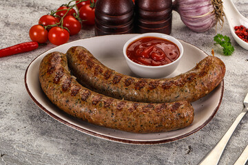 Grilled beef sausages with sauce