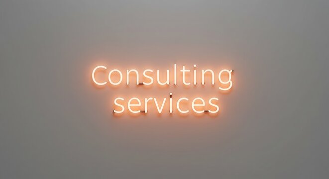 Illuminated neon sign glows with the words 'Consulting services' casting a warm orange light on a neutral background, perfect for business branding and professional services. - Powered by Adobe