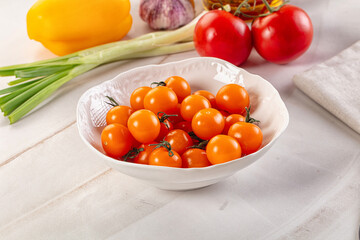 Ripe juicy yellow cherry tomato
