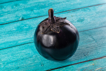Raw round black big eggplant