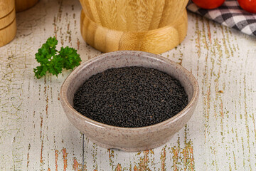 Black dry Nigella seeds in the bowl