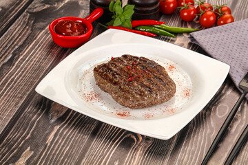 Grilled beef burger cutlet with sauce