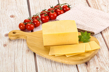 Yellow cheese piece with slices