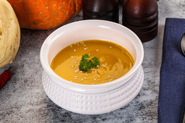 Vegan pumpkin cream soup served sesam