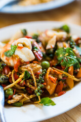 Thai stir fried spicy seafood served on dish. Thai called Pad Cha Talay