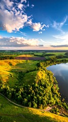 Panoramic view of a landscape with hills, fields, and a lake