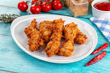 Golden crispy fried chicken strips