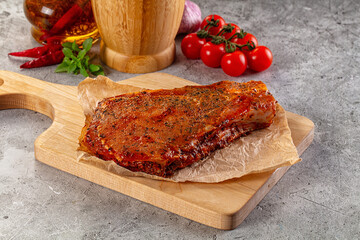 Raw marinated pork loin steak