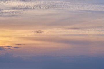 Fototapeta premium Sunset, pattern and sky with clouds for background, aesthetic and natural beauty. Nature, atmosphere and cloudy streak with sunshine for evening, dusk and light on horizon, scenic view or skyline