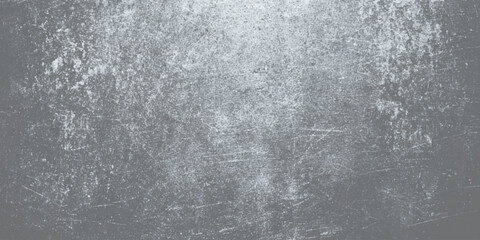 A textured surface with a dark, gritty appearance, resembling a weathered or scratched material such as old metal or painted wall, dark gray, with a rough, uneven texture featuring scattered.